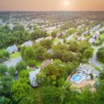 Aerial view of single family homes, a residential district Sayreville near pond in New Jersey US